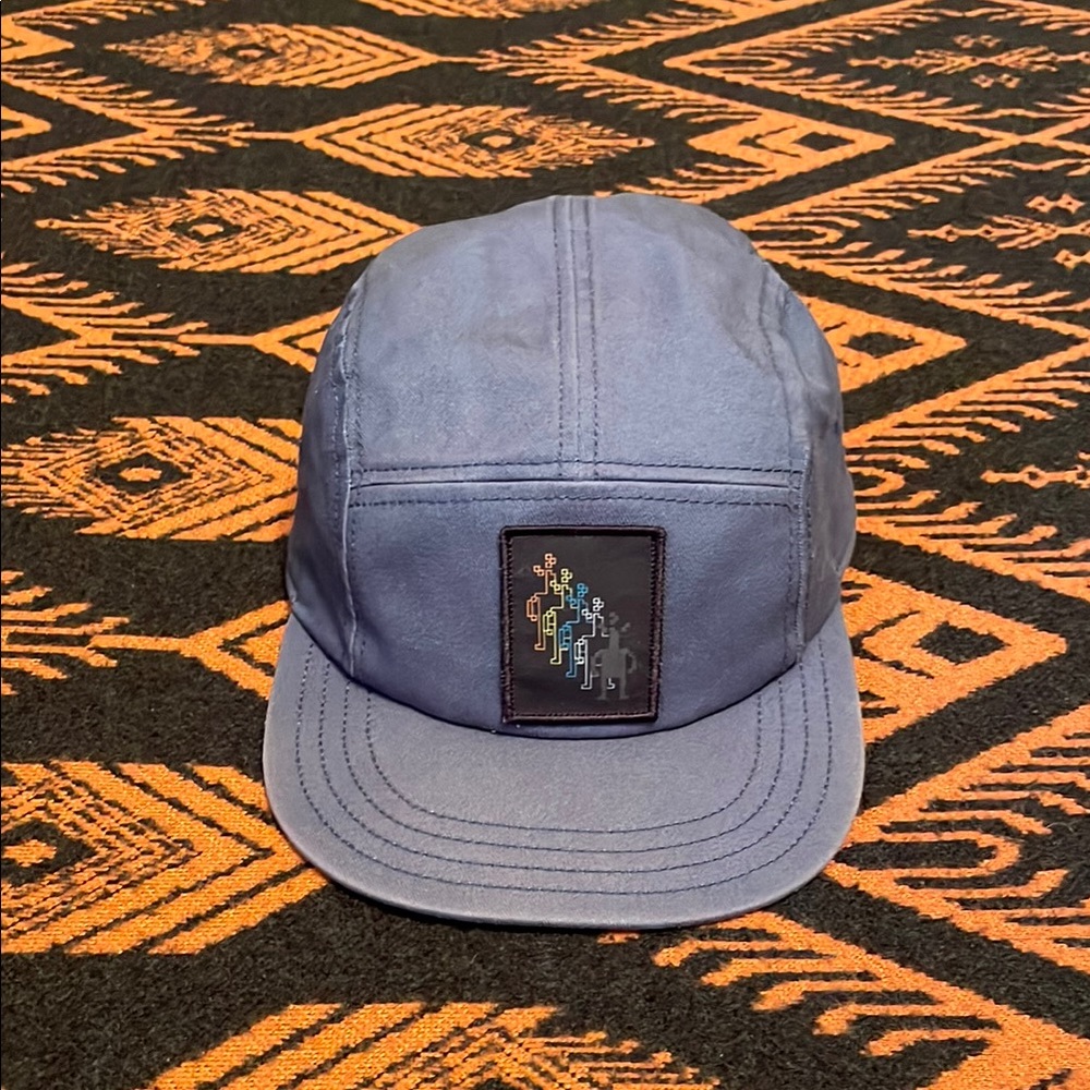 Smartwool 5-panel with Flat Brim and Little Guy logo.